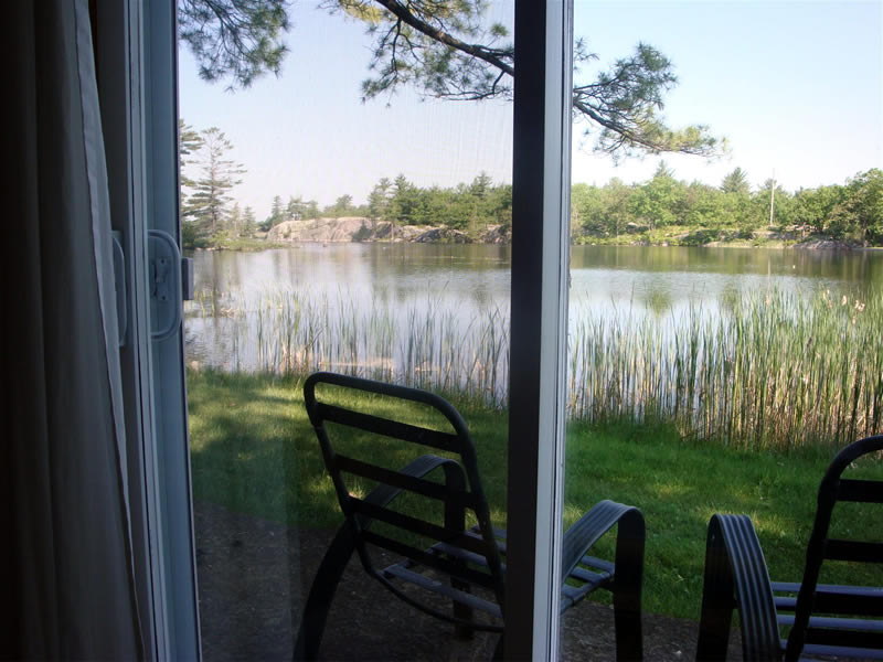 Log view from patio doors in seating area at front
