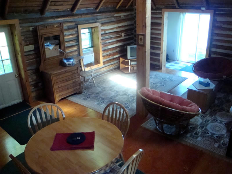 Log view from stairway to bedroom